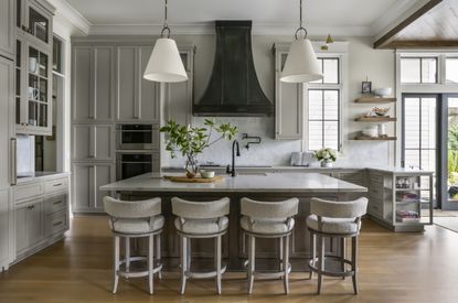 how to make your kitchen island look more expensive; grey kitchen with built-in appliances by Brad Ramsey