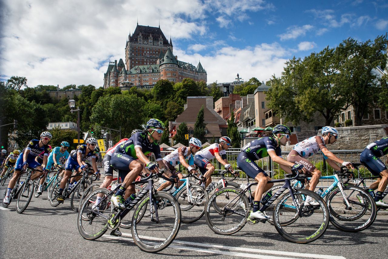 Riders pass by the famed Fairmont Le Chateau Frontenac in Old Quebec City.