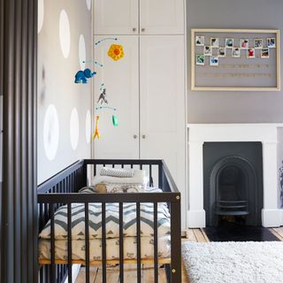 kids room with white door and grey wooden kids bed