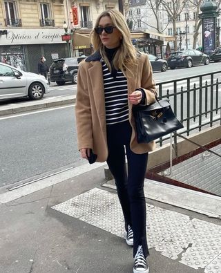 Woman wearing a fall work outfit.