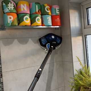 Cleaning the bathroom wall tiles with the Polti Vaporetto steam cleaner