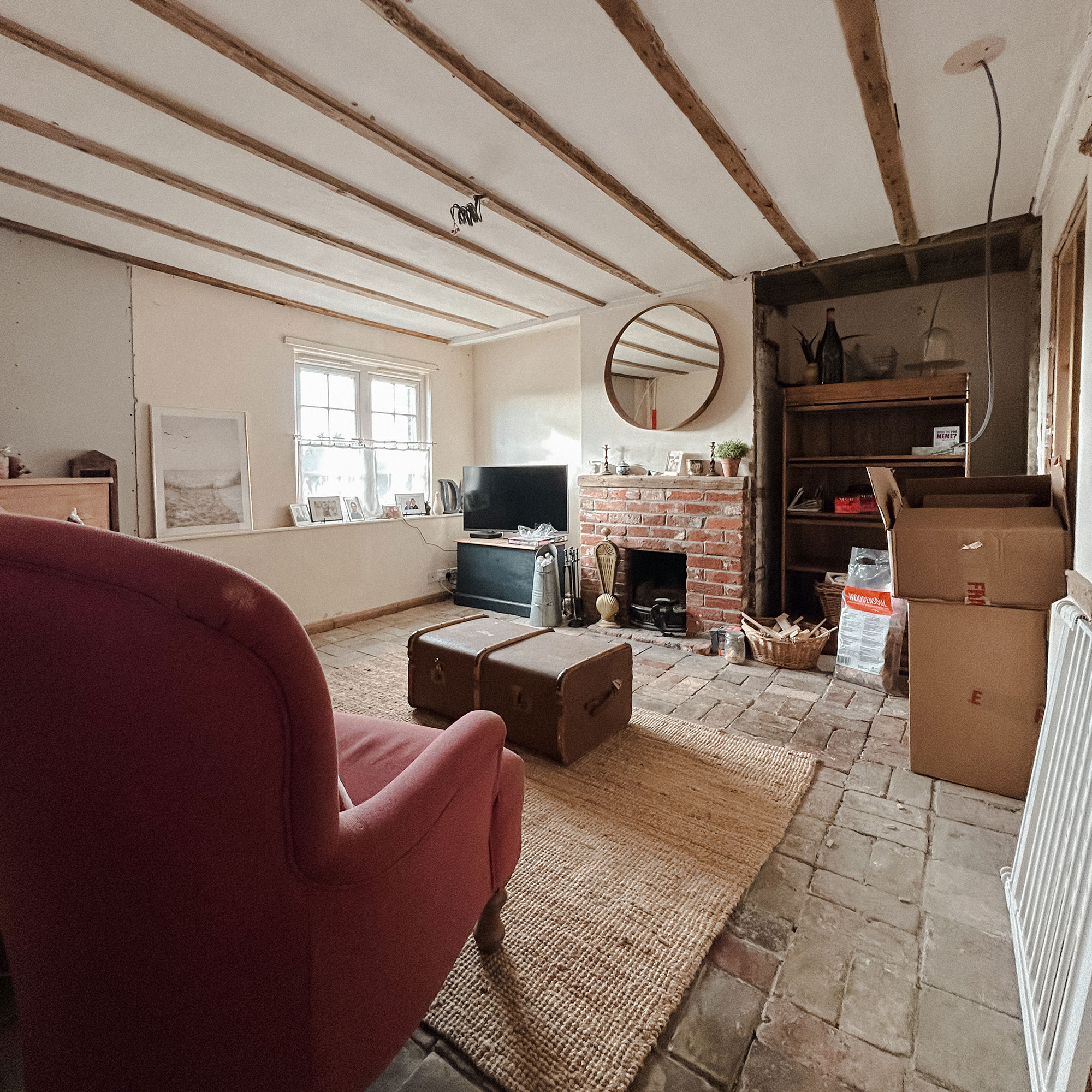 Snug with stone floors, brick fireplace and exposed electrics from ceiling