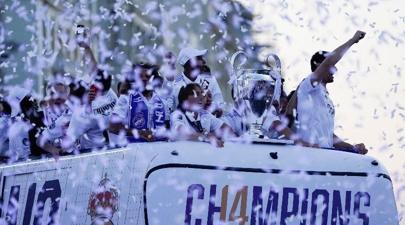 Real Madrid players celebrate their 2022 Champions League win in a bus parade in Madrid after beating Liverpool in Paris in May 2022.