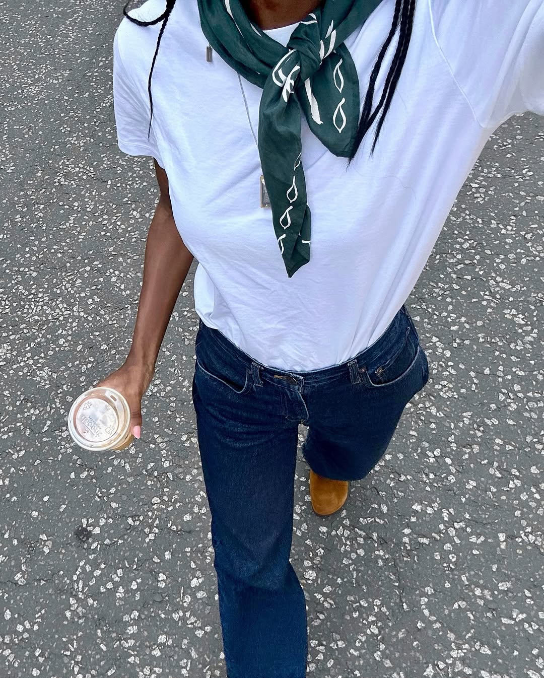 Woman wearing dark wash bootcut jeans fall 2025.