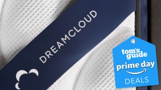 Best Prime Day mattress deals away from Amazon, banner image featuring a closeup of the details of a DreamCloud Hybrid mattress, with a Prime Day tag in the lower right corner