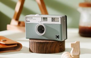 The Kodak Extar H35 film camera in silver, lifestyle