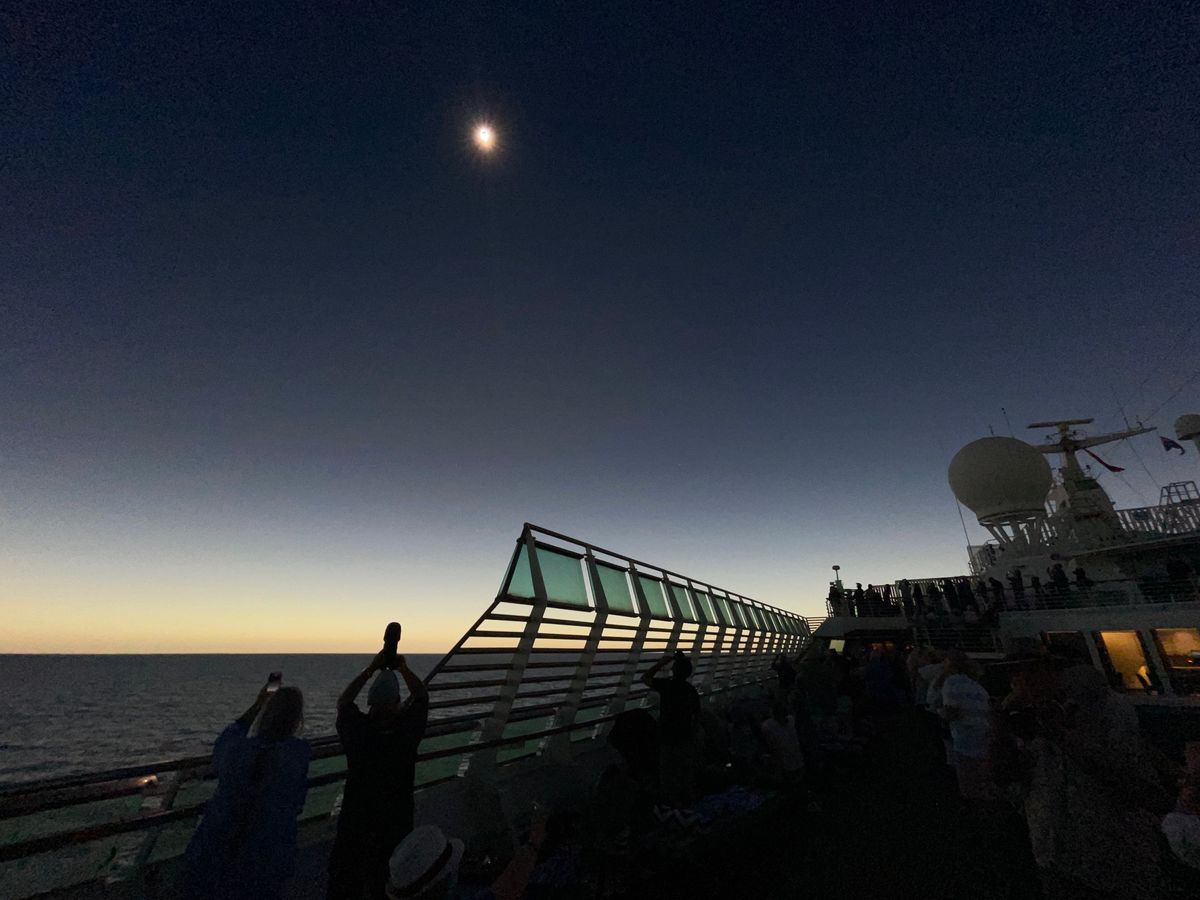 Hybrid solar eclipse captured during a P&amp;O Pacific Explorer cruise ship in the Exmouth Gulf