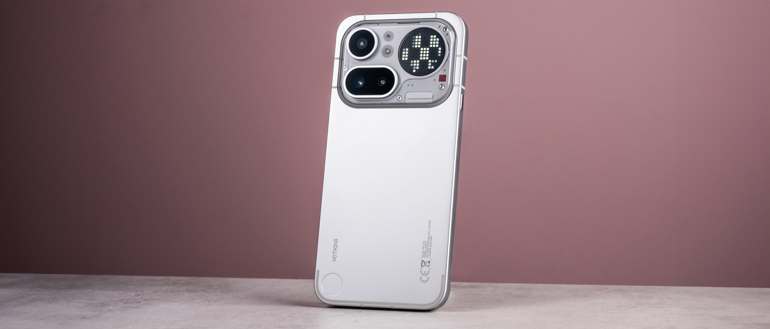 The Nothing Phone (4a) Pro's back showing its aluminum unibody, camera module and Glyph Matrix, which is midway through showing a moving glyph.