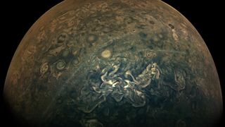 Hazy clouds streak across Jupiter's northern hemisphere in this new image from NASA's Juno spacecraft. These long, thin cloud bands consist of haze particles that drift above the planet's underlying cloud features. While the cause of these wispy clouds is still a bit of a mystery, scientists believe the hazy features could be related to Jupiter's jet streams. "Two jet streams in Jupiter's atmosphere flank either side of the region where the narrow bands of haze typically appear, and some researchers speculate those jet streams may influence the formation of the high hazes," NASA officials said in a statement. The Juno orbiter captured this image during its 25th close flyby of Jupiter, also known as a perijove, on Feb. 17 at 12:29 p.m. EST (1729 GMT), when the spacecraft was about 15,610 miles (25,120 kilometers) from the planet's cloud tops.