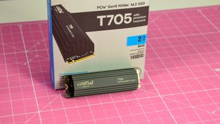 A Crucial T705 SSD on a pink desk mat