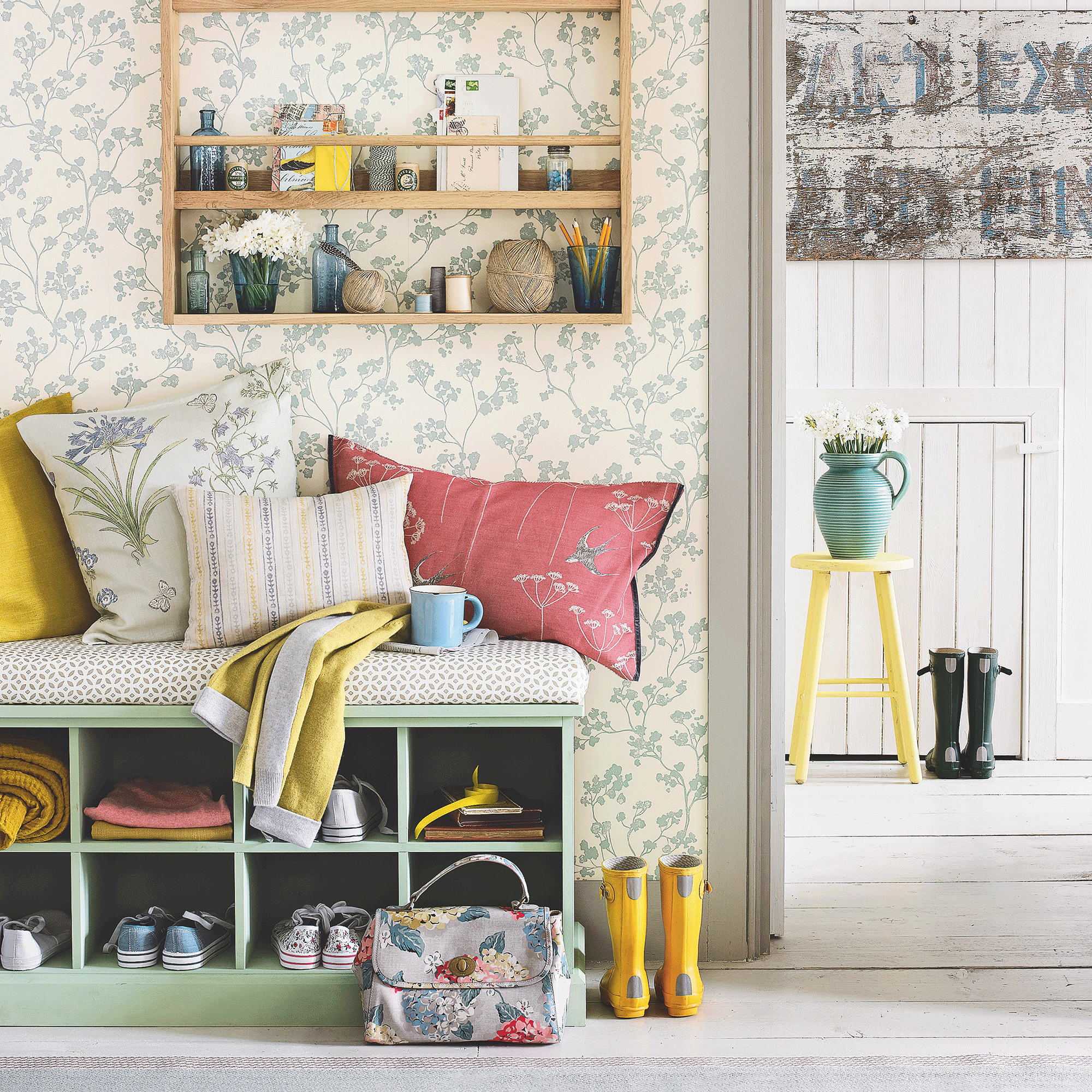 Wallpapered hallway with storage bench