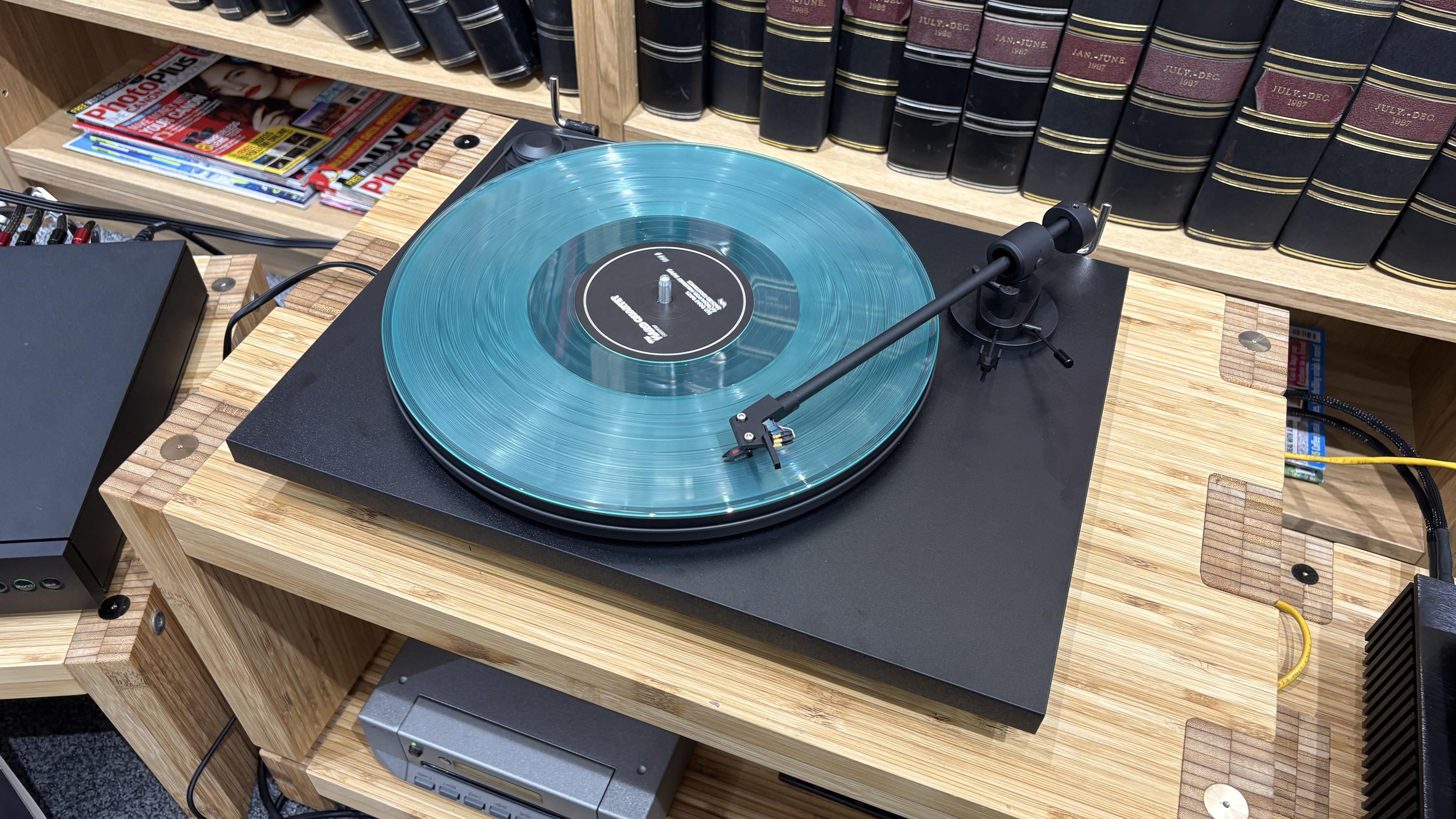 Pro-Ject Primary E turntable on wooden rack