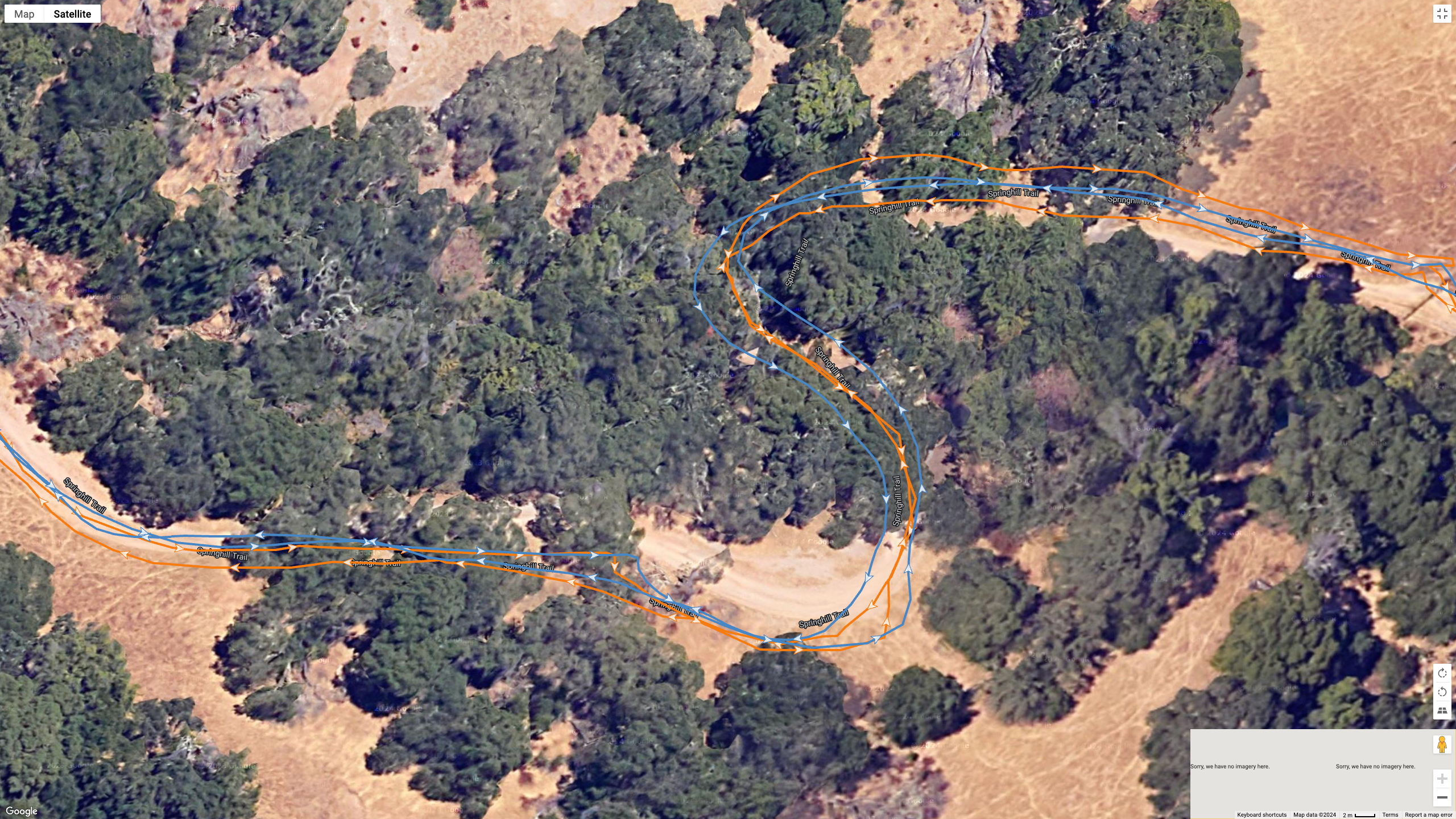 A Google Earth satellite image showing how the COROS PACE Pro (blue line) compares to the Garmin Fenix 8 (orange line) for a dual-band GPS accuracy test.