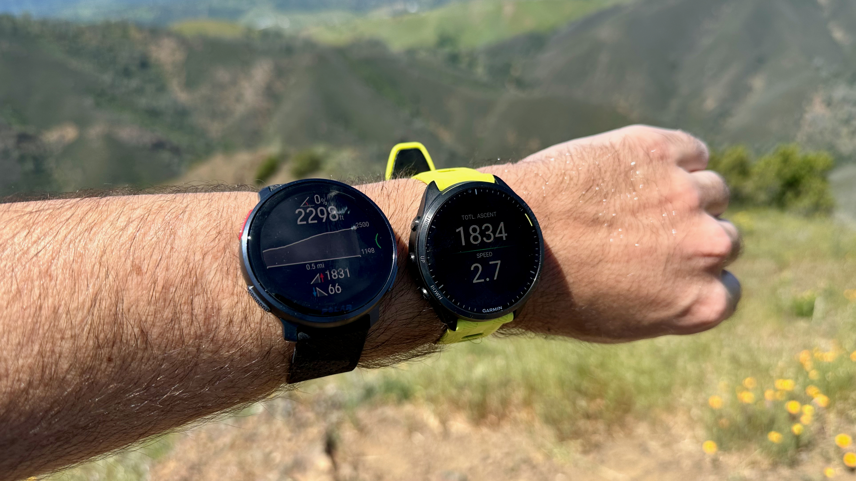 The Garmin Forerunner 965 and Polar Vantage V3 are worn on one arm and display elevation data.