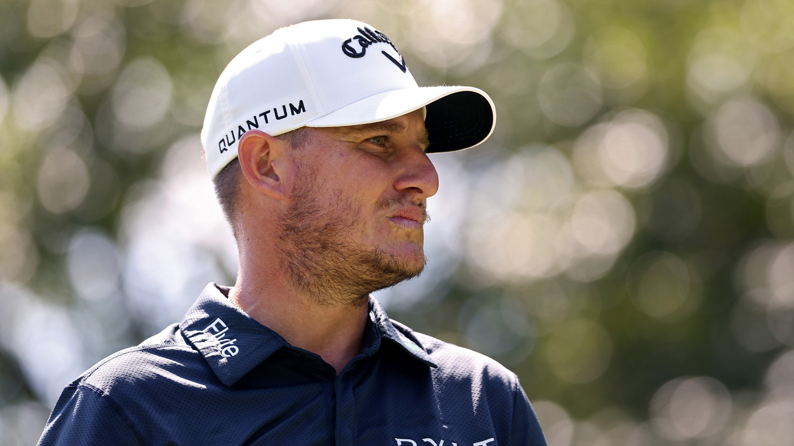 Emiliano Grillo scowls and looks into the distance