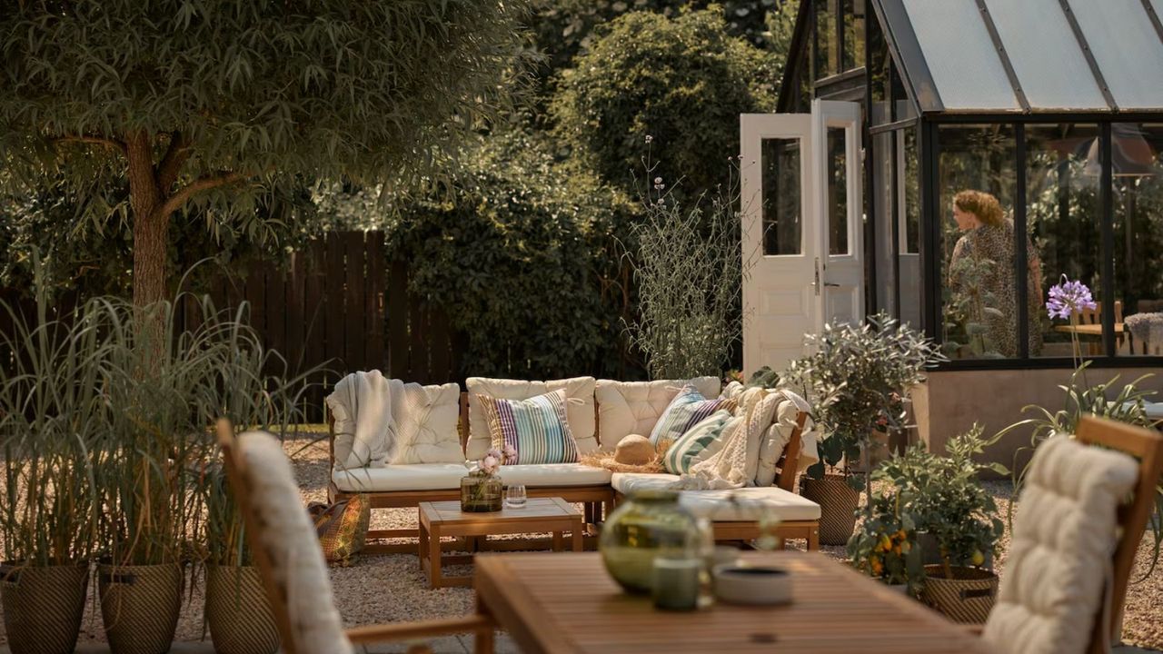 Patio with wooden and cream sofa from IKEA