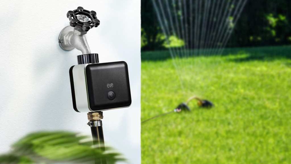The Eve Aqua smart water controller attached to an outdoor faucet