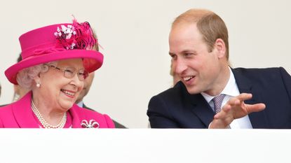 Queen Elizabeth II and Prince William, Duke of Cambridge watch a carnival parade