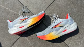 Brooks Hyperion Max 2 running shoes on a sidewalk