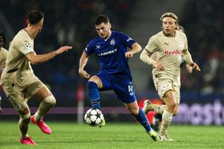 SALZBURG, AUSTRIA - OCTOBER 23: Mads Bidstrup of FC Salzurg challenges Martin Baturina of GNK Dinamo during the UEFA Champions League 2024/25 League Phase MD3 match between FC Salzburg and GNK Dinamo at Stadion Salzburg on October 23, 2024 in Salzburg, Austria. (Photo by Jasmin Walter/Getty Images)