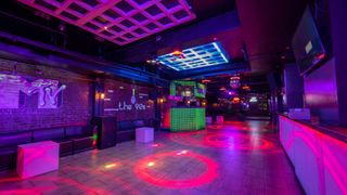 Decades nightclub's themed rooms, this one in purple hues and neon lights, have the volume turned up with the DAS Audio E11EVEN system.