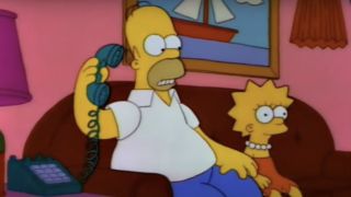 Homer on the phone looking concerned at Lisa on The Simpsons