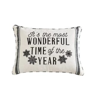 A Christmas pillow that says 