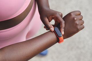Weight loss tips: A woman checking her fitness tracker