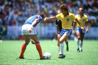 Brazil's Zico takes on a French defender during the teams' 1986 World Cup quarter-final in Mexico.
