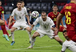 Italy’s Giorgio Chiellini stoops to head the ball