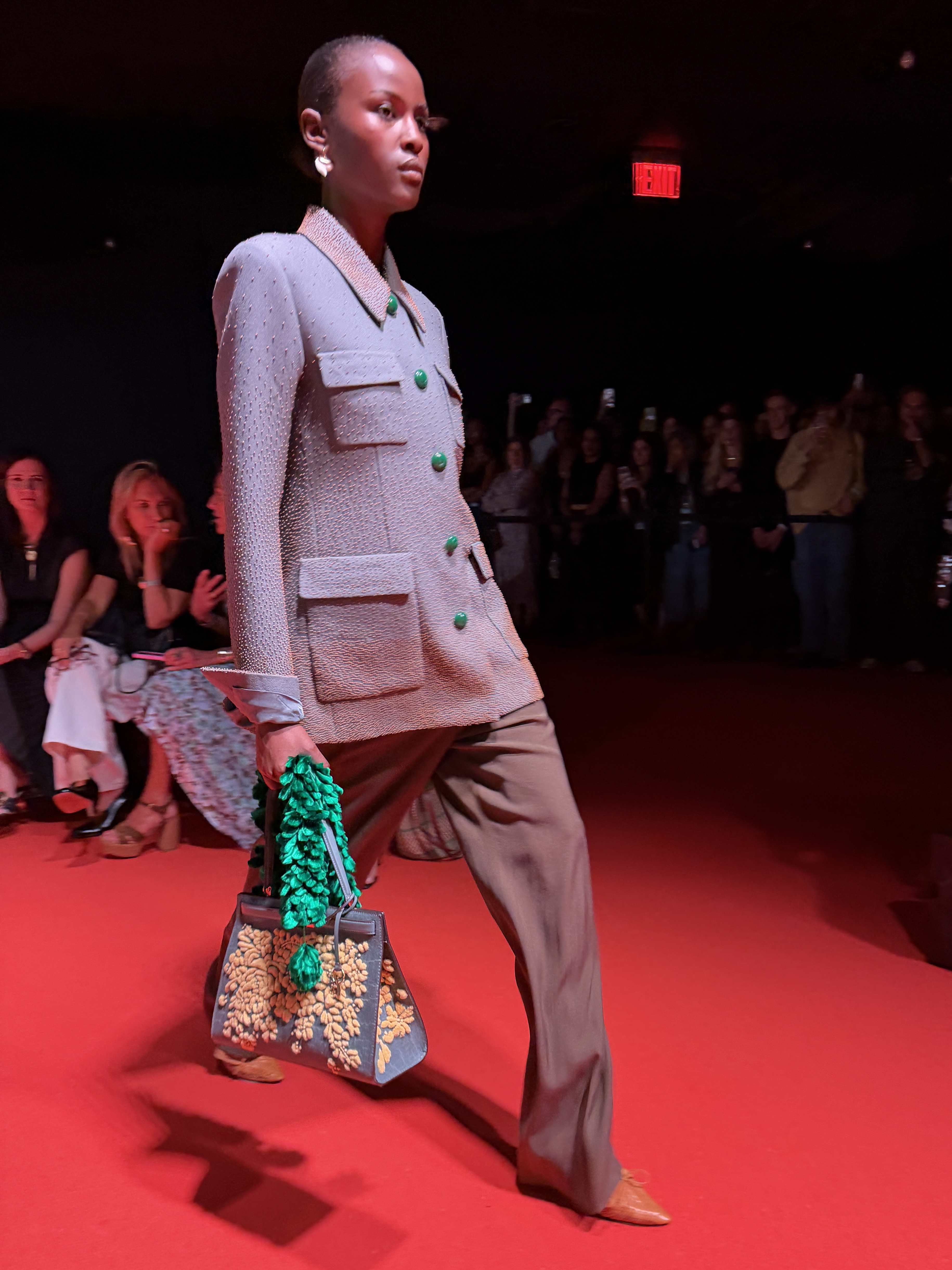 A model walking in a gray suit at the Tory Burch show during New York Fashion Week.