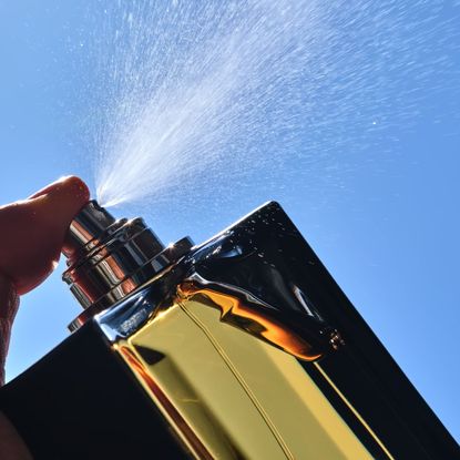 Perfume spraying into the sky