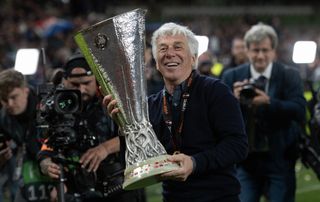 Gian Piero Gasperini celebrates with the trophy after Atalanta's Europa League final win against Bayer Leverkusen in May 2024.