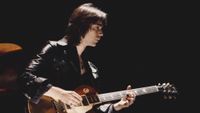 British guitarist Steve Hackett of rock group Genesis performing with a Gibson Les Paul Goldtop, 1974