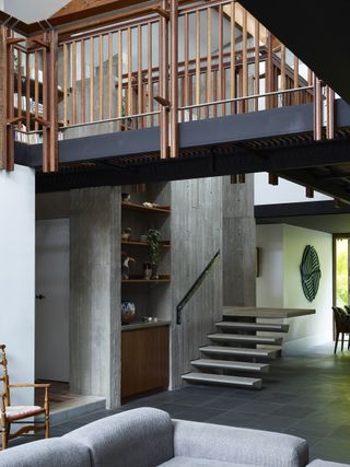 Interior showing mezzanine at Stockroom Cottage by Architects EAT