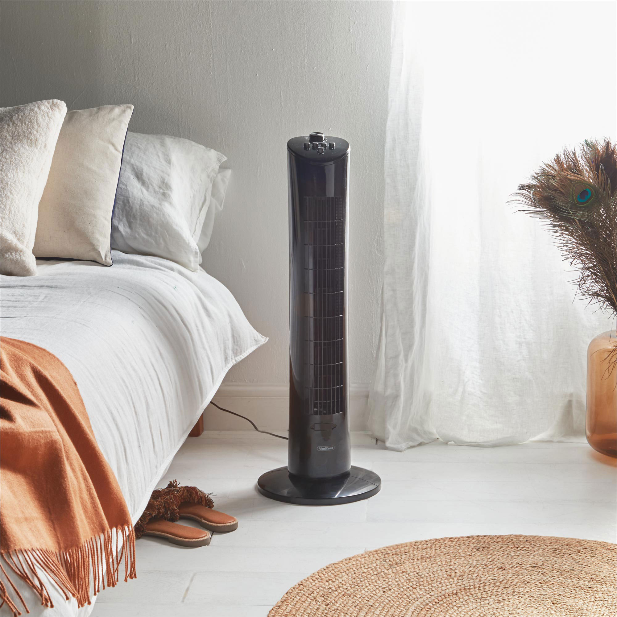 black tower fan in bedroom