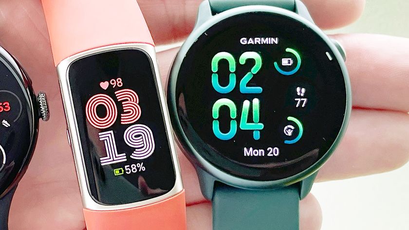Close-up of Garmin Vivoactive 6 and Fitbit Charge 6