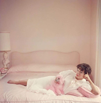 Joan Collins relaxes, by Slim Aarons