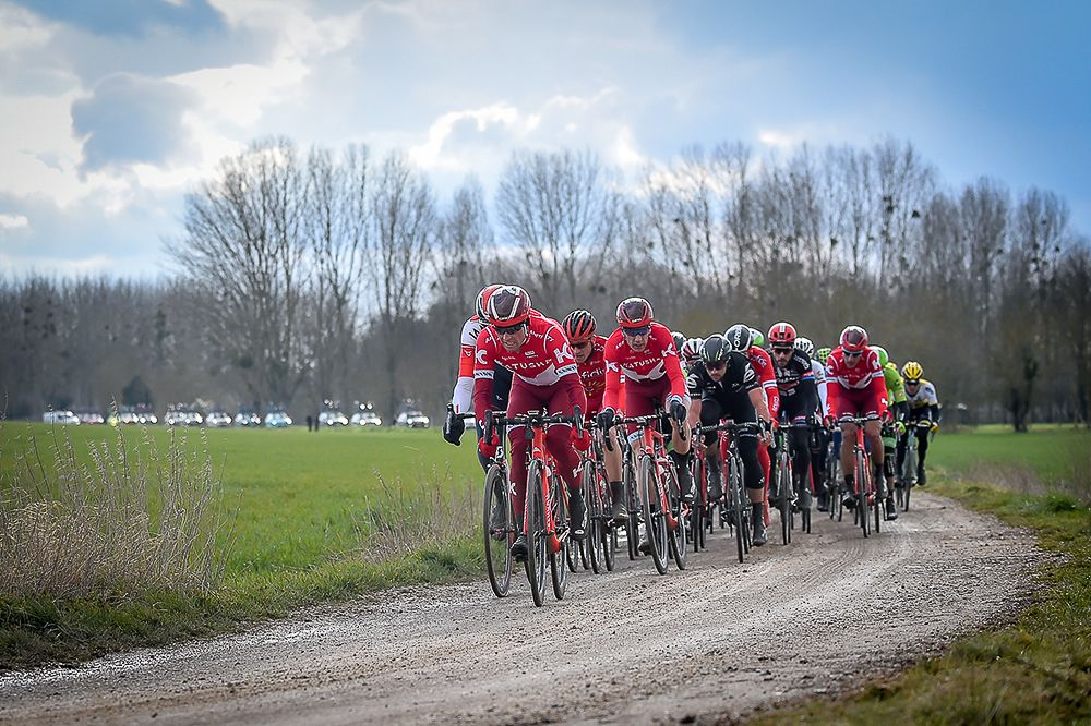 The peloton rides on the gravel roads during stage 1 at Paris-Nice