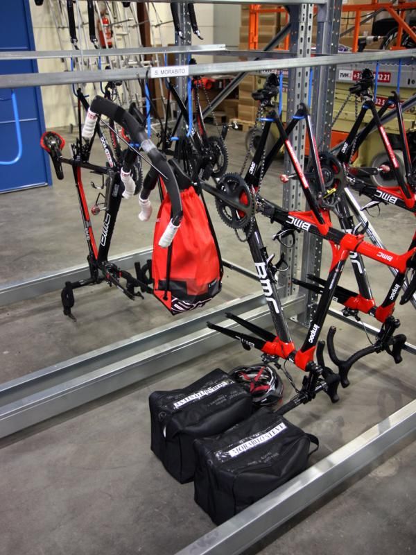 Team bikes are generally organized by rider with each getting their own section in the racks.
