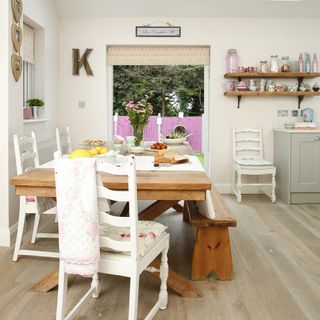 kitchen with dining table and open garden