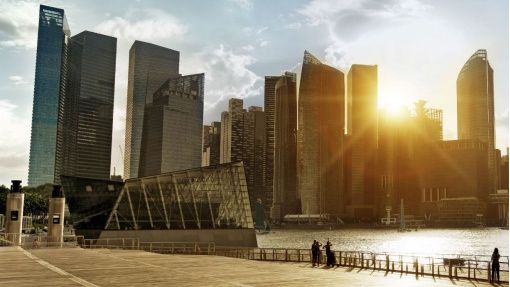 Whitepaper covet with image of cityscape in front of water with people enjoying the sunset behind the buildings