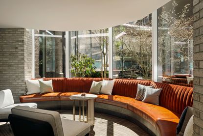interiors view of orange sofa in The Lantern in New York 