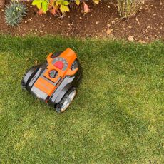 LawnMaster OcuMow 16 Vision Robot Lawnmower mowing up to flower border
