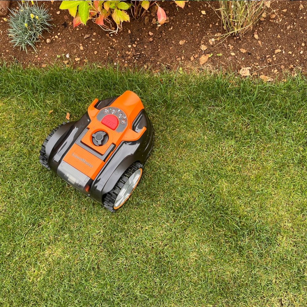 LawnMaster OcuMow 16 Vision Robot Lawnmower mowing up to flower border