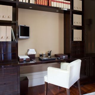 desk area with white chair and shelf storage