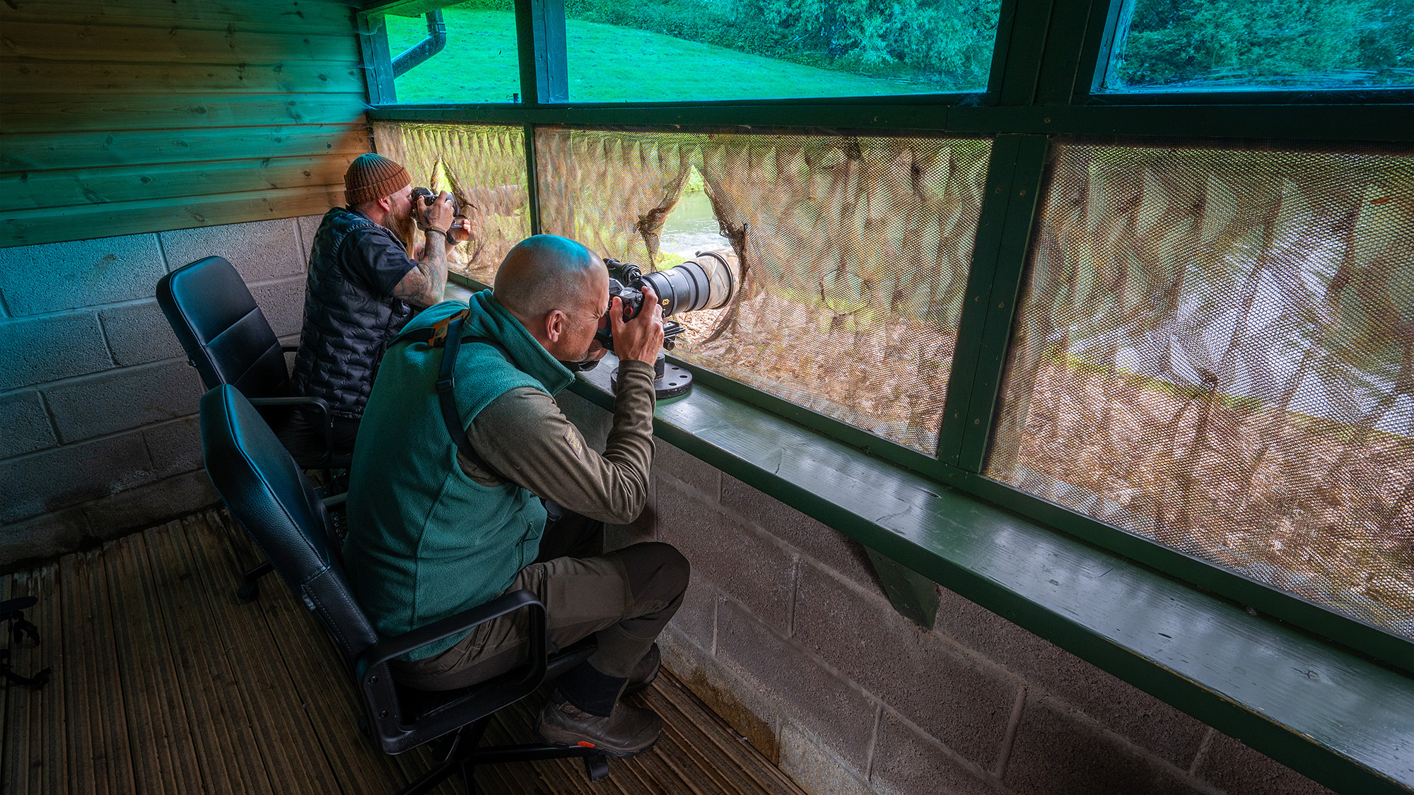 Two photographers inside osprey hide