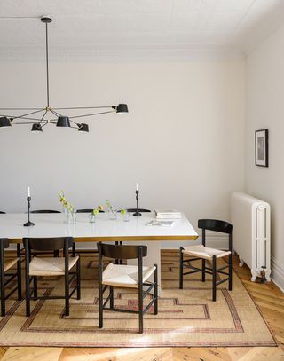 Minimalist modern dining room with black pendant light