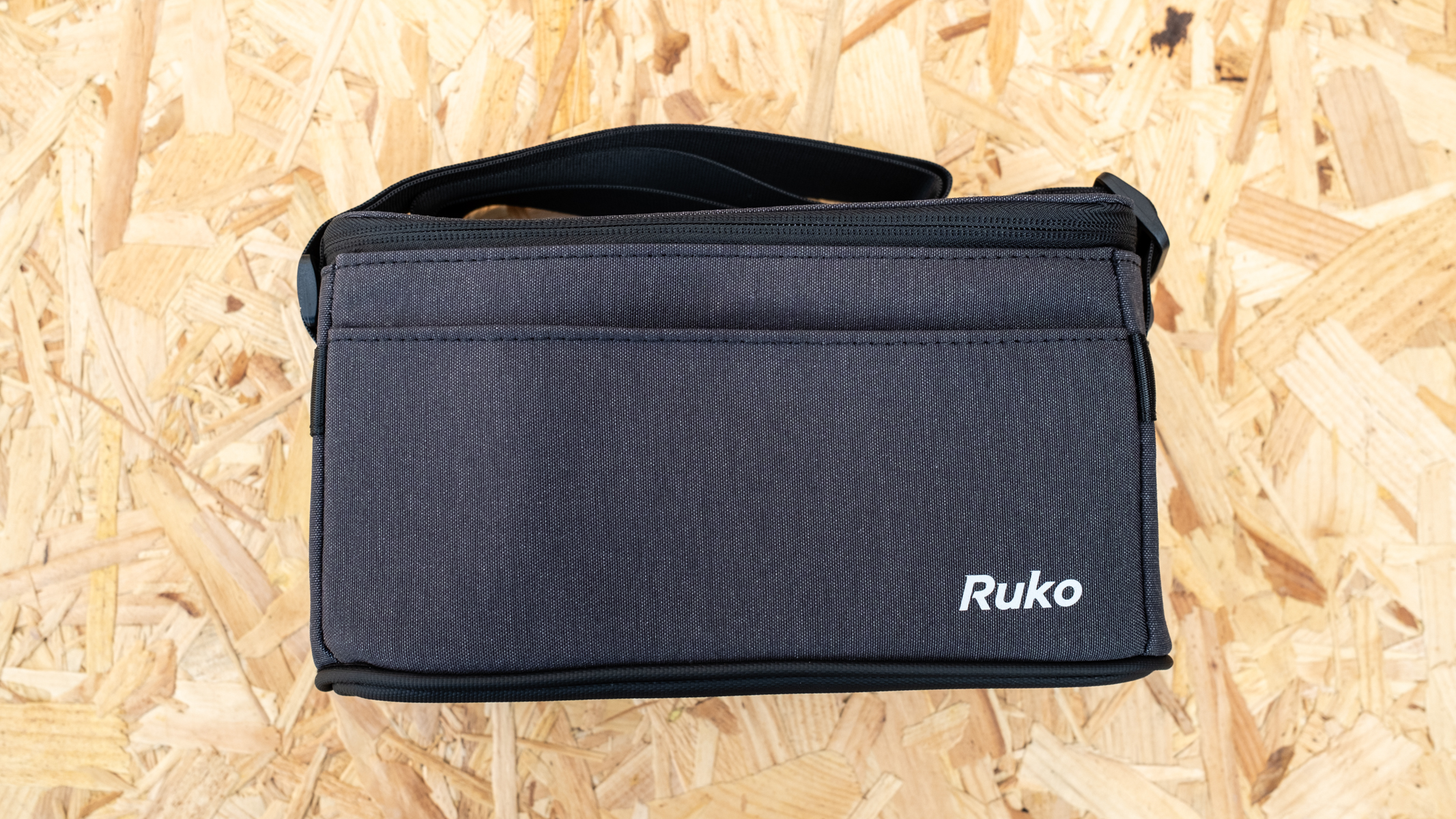 Ruko F11 Mini carry bag on oriented strand board