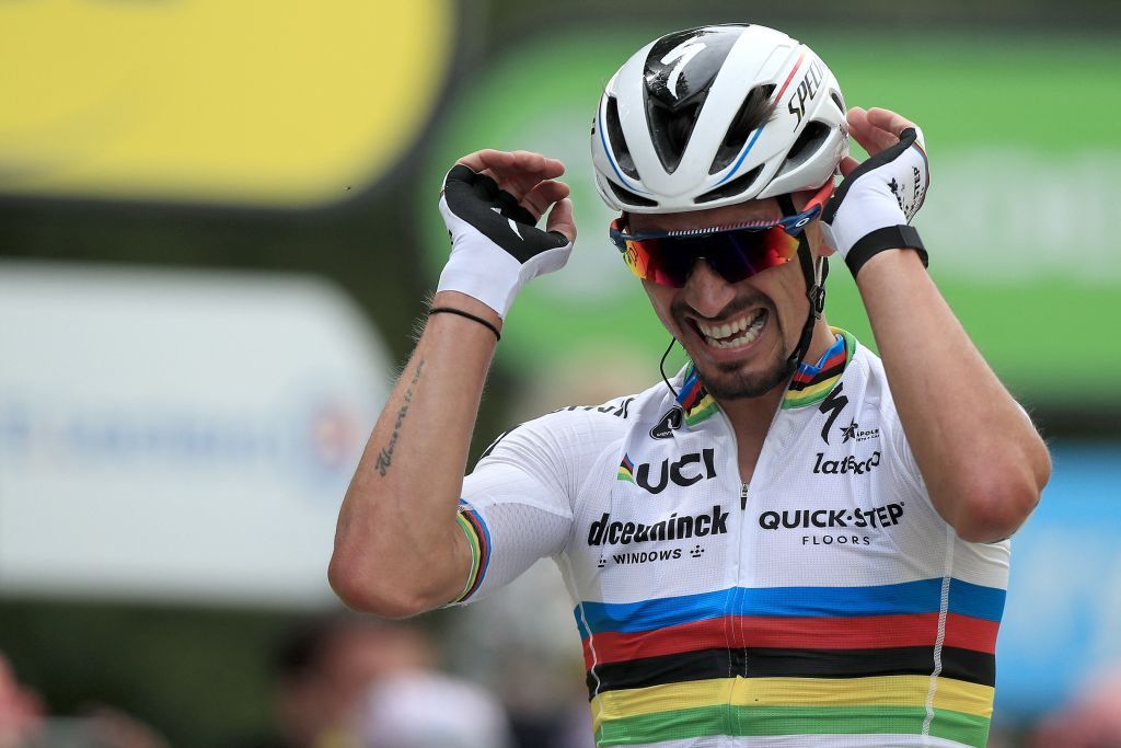 eam Deceuninck Quicksteps Julian Alaphilippe of France celebrates as he crosses the finish line to win the 1st stage of the 108th edition of the Tour de France cycling race 197 km between Brest and Landerneau on June 26 2021 Photo by Christophe Petit Tesson various sources AFP Photo by CHRISTOPHE PETIT TESSONAFP via Getty Images